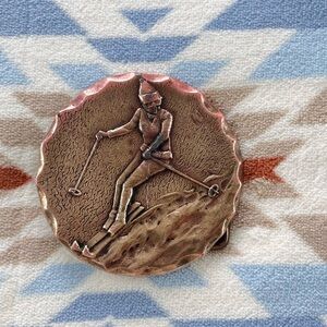 1978 women skier heavy brass buckle, USA made